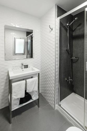 Foto del baño de Elite Hotel - Gay Men Only