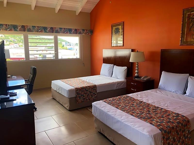 Foto de una habitación de Carl&amp;#039;s Unique Inn &amp;amp; Conference Facilities