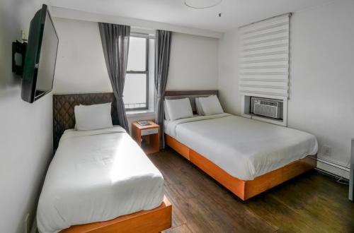 Foto de una habitación de Midtown West Hotel