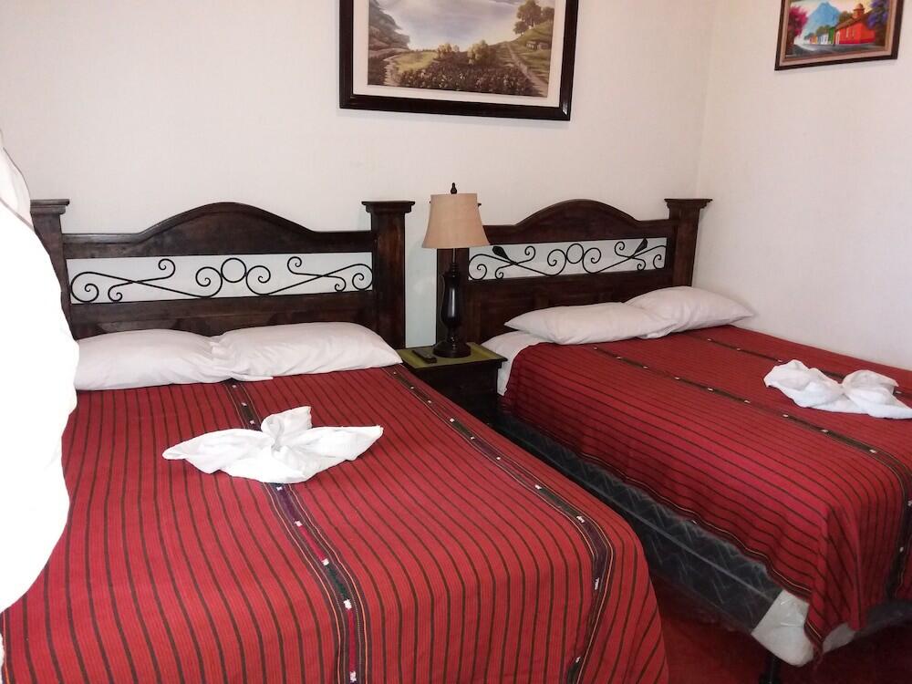 Foto de una habitación de Hotel Dionisio Inn