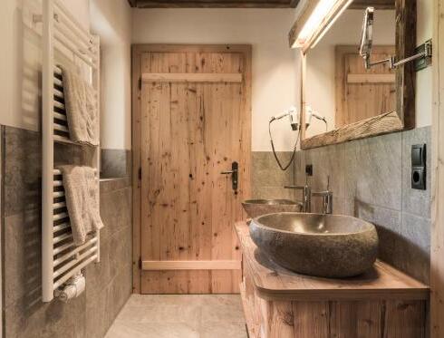 Foto del bagno Case e chalet Hüttendorf Ladizium