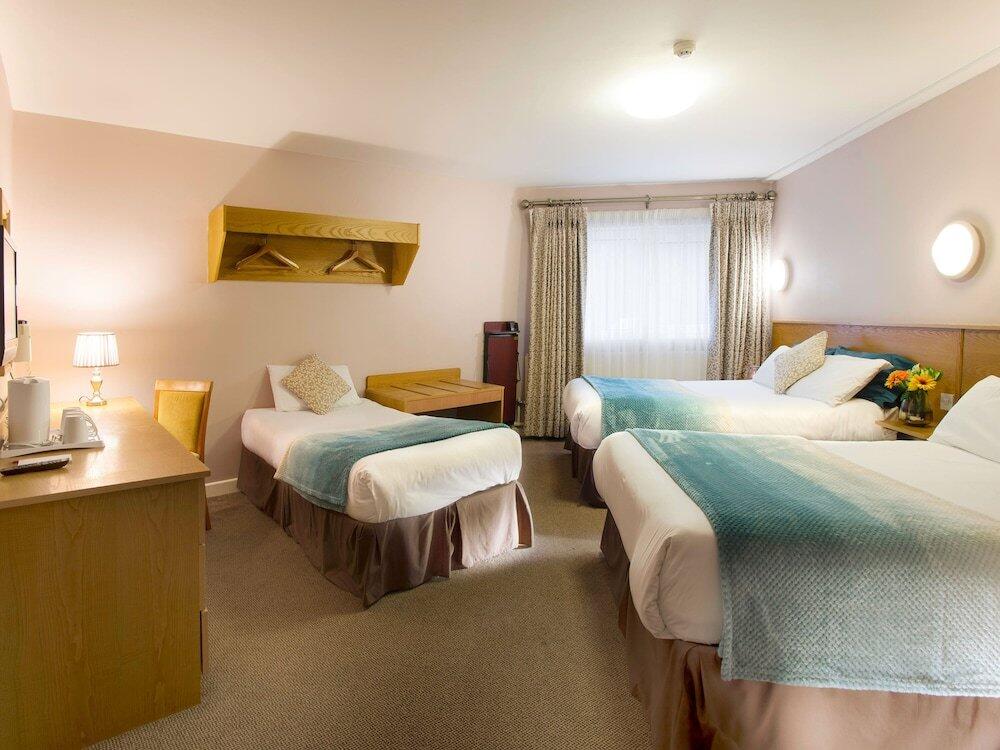 Foto de una habitación de Hotel The Commons Express Inn 