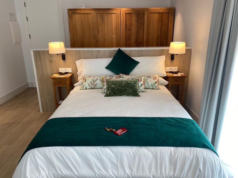 Foto de una habitación de Apartamentos Turísticos La Plaza