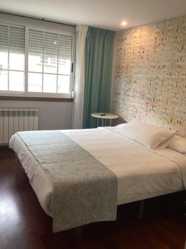 Foto de una habitación de Saudade Hostal Cafetería