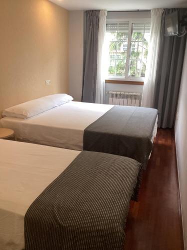 Foto de una habitación de Saudade Hostal Cafetería