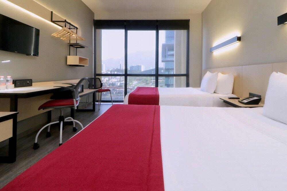Foto de una habitación de Hotel City Express Plus Monterrey Galerías