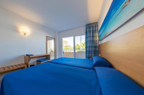 Foto de una habitación de Hotel Club Cala Romani