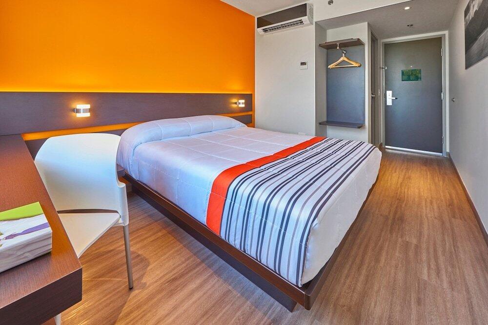 Foto de una habitación de Hotel City Express Junior Tuxtepec