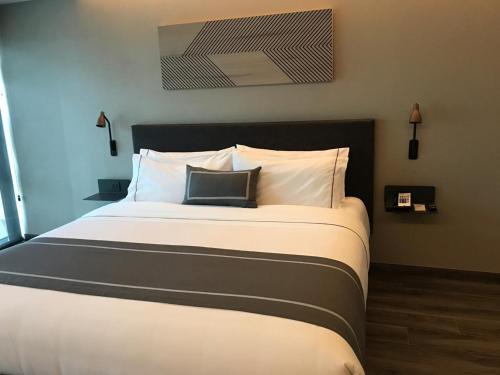 Foto de una habitación de Hotel City Express Plus Merida