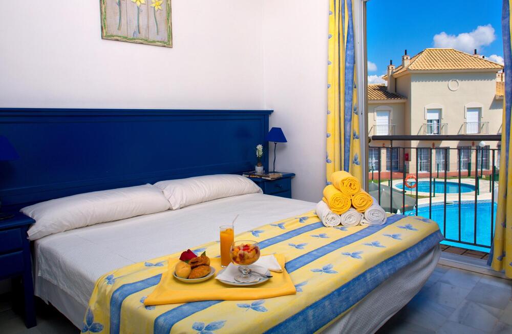 Foto de una habitación de Apartamentos Interpass Golf Playa Country Club