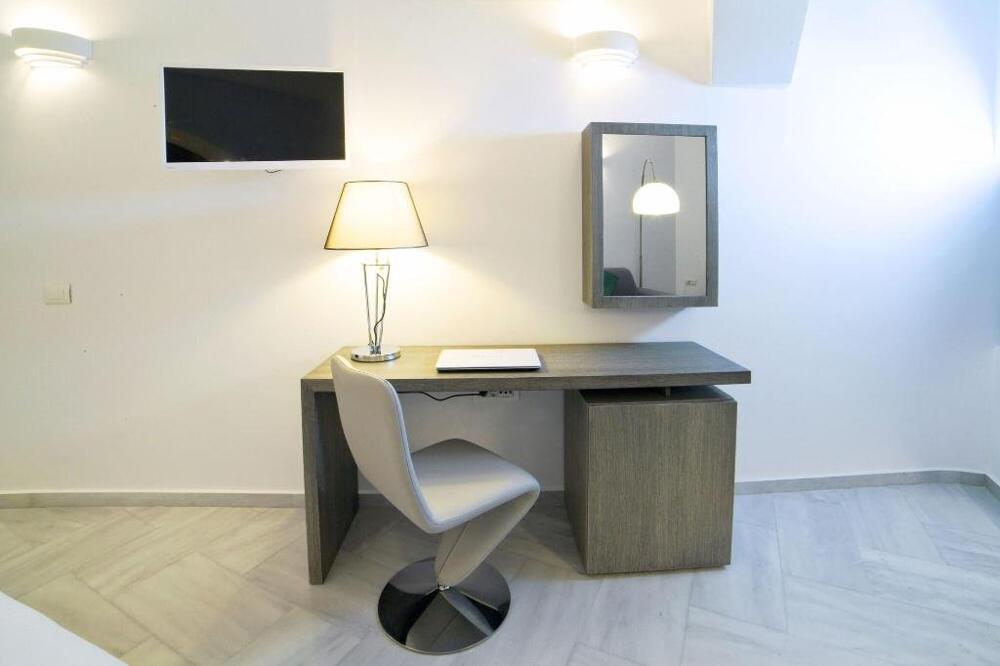Foto de una habitación de Hotel Anteliz Suites