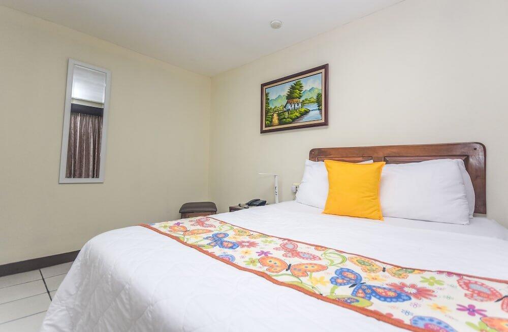 Foto de una habitación de Hotel Berlor Airport Inn
