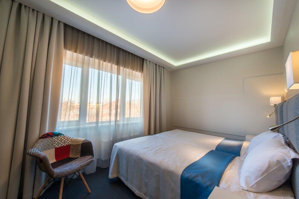 Foto de una habitación de Amrita Hotel