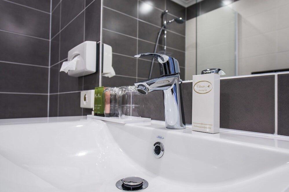 Foto del baño de Amrita Hotel