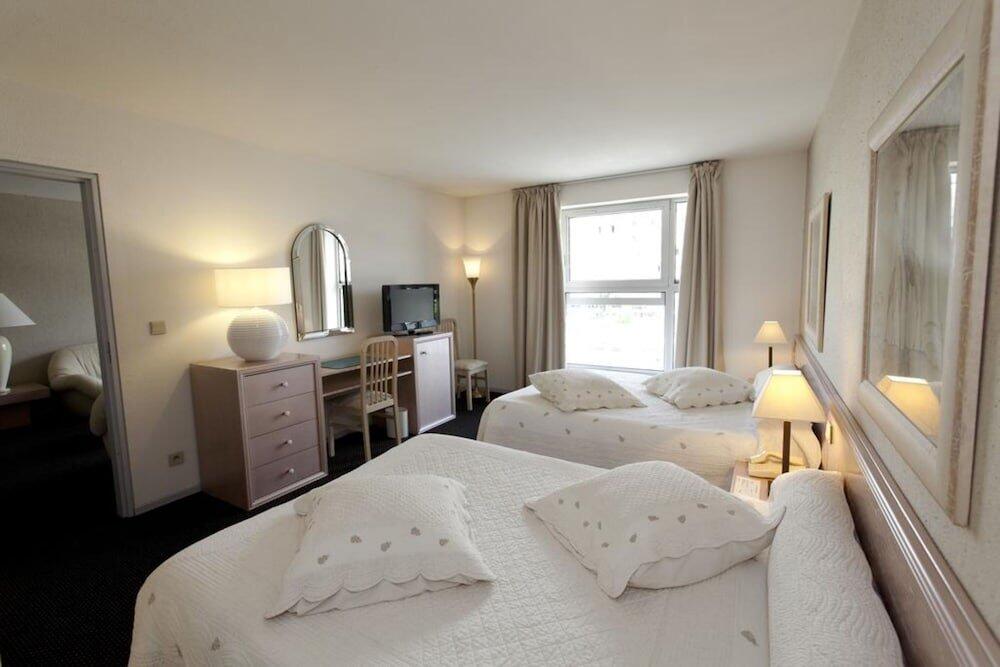 Foto de una habitación de Hôtel Paradis