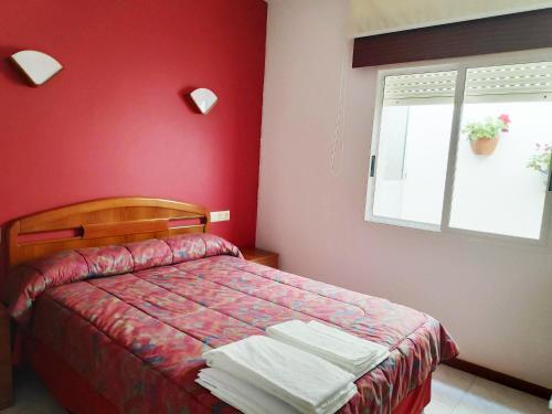 Foto de una habitación de Apartamentos Playa de la Lanzada 3000