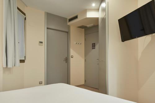 Foto de una habitación de Welcome Gros Hotel