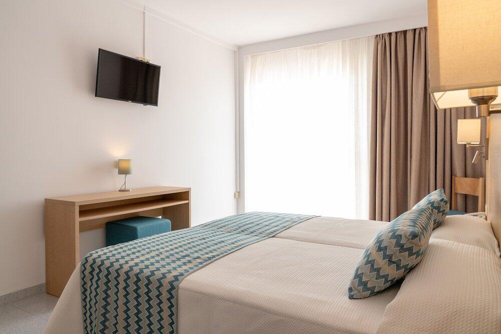 Foto de una habitación de Hotel Riutort