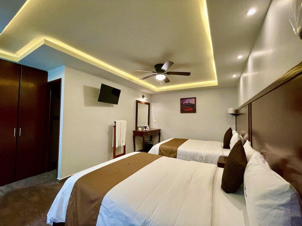 Foto de una habitación de Hotel Puebla Plaza