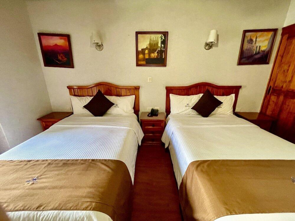 Foto de una habitación de Hotel Puebla Plaza