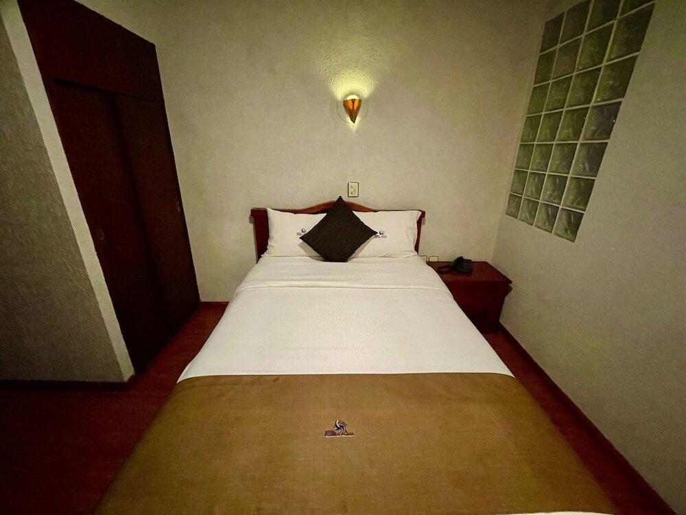 Foto de una habitación de Hotel Puebla Plaza
