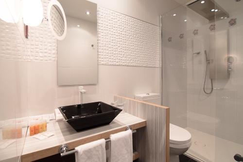Foto del baño de Hotel Petit Palace Savoy Alfonso XII