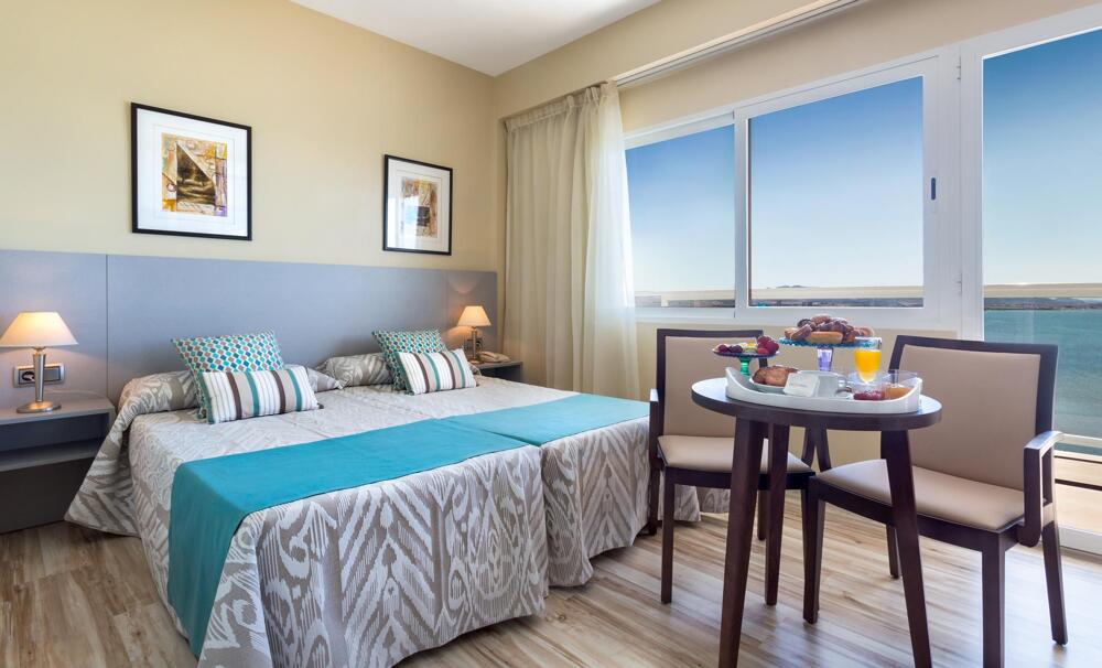 Foto de una habitación de Hotel Izán Cavanna