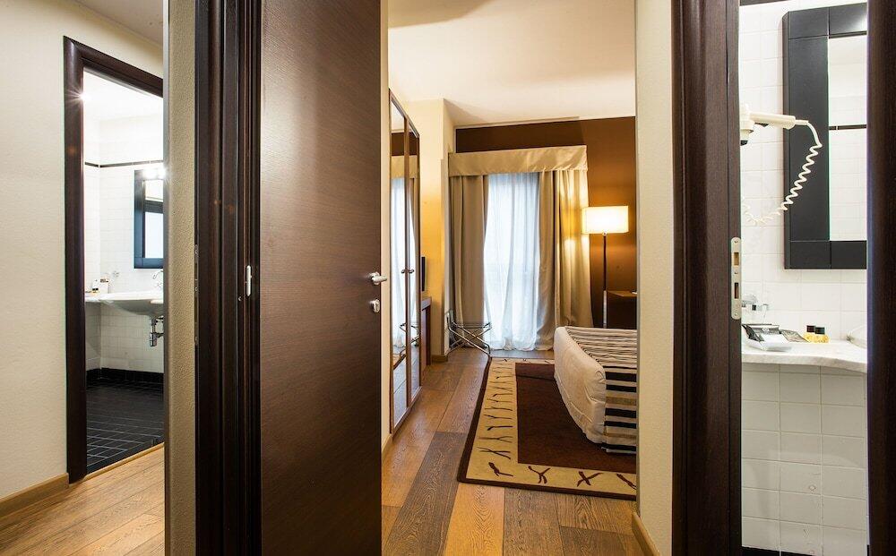 Foto de una habitación de Sardegna Hotel - Suites &amp;amp; Restaurant