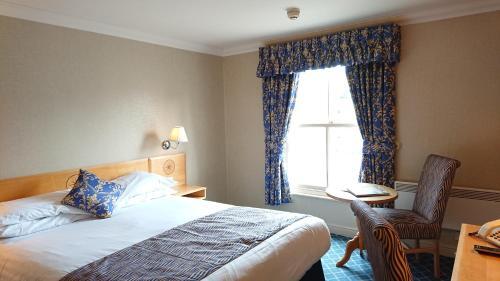 Foto de una habitación de The Queens Hotel