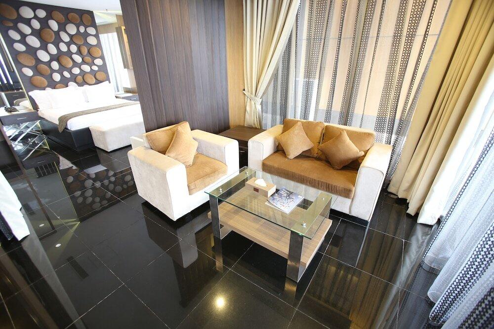 Foto de una habitación de Merlynn Park Hotel