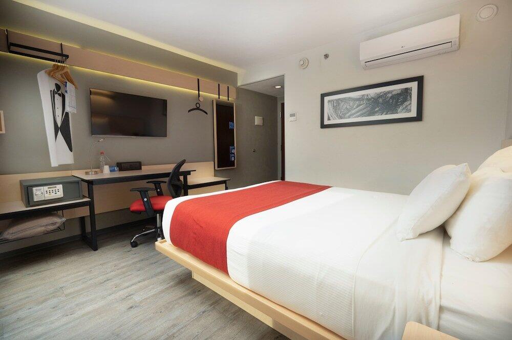 Foto de una habitación de Hotel City Express Santiago Aeropuerto