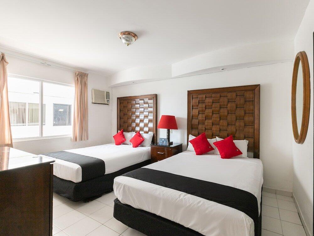 Foto de una habitación de Hotel Capital O Zona Dorada Inn, Mazatlán