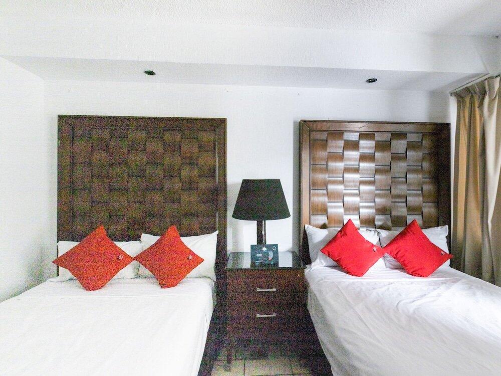 Foto de una habitación de Hotel Capital O Zona Dorada Inn, Mazatlán