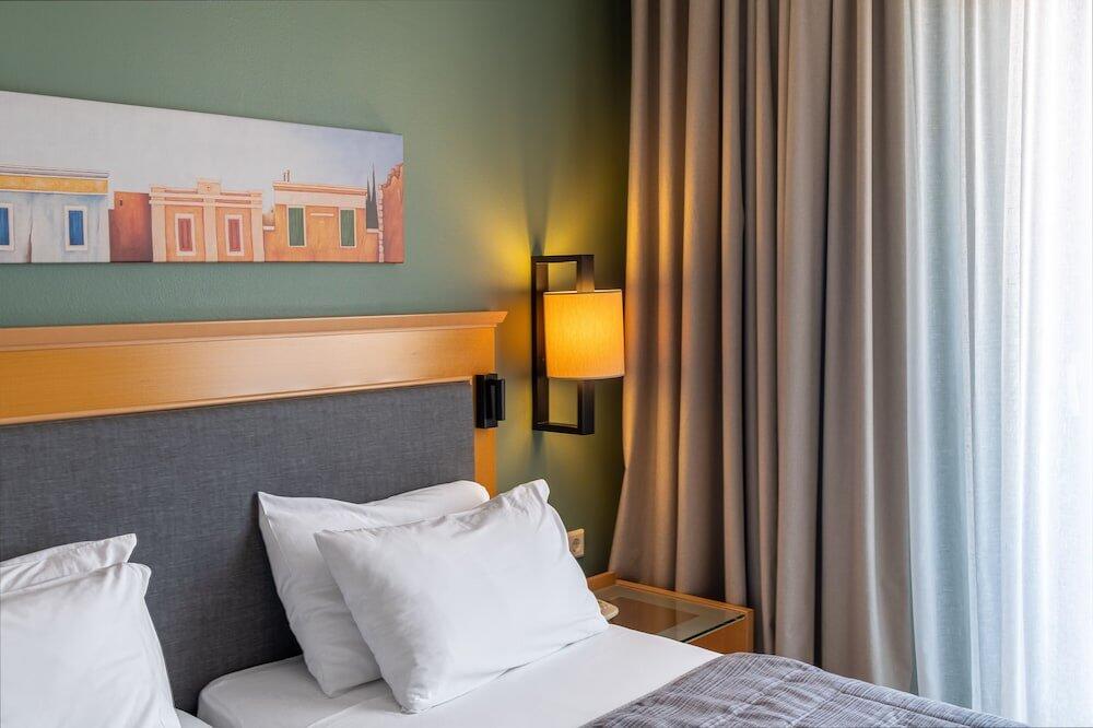 Foto de una habitación de Plaka Hotel