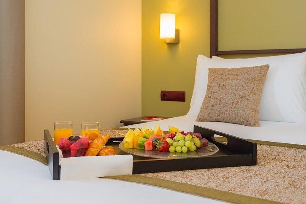 Foto de una habitación de Hotel Exe Layos Golf