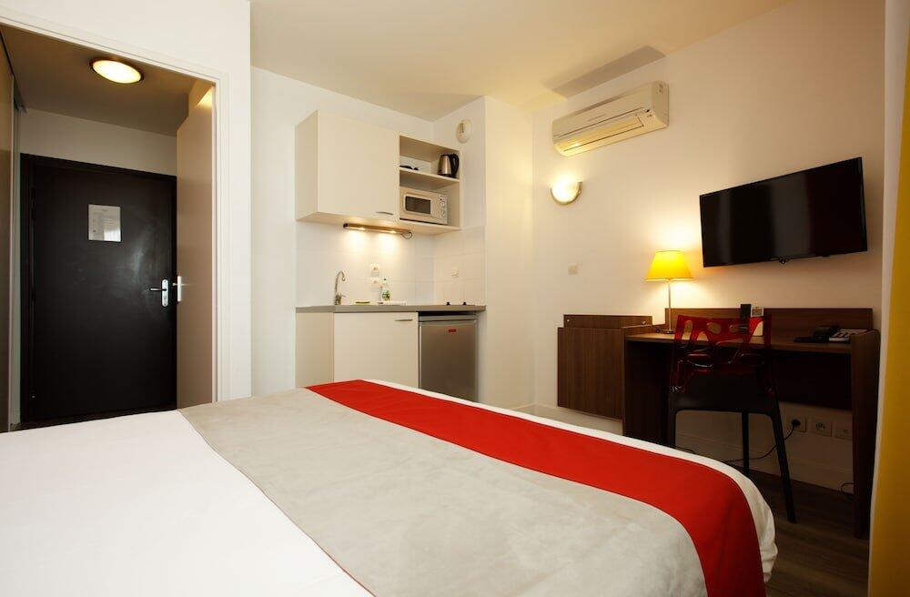 Foto de una habitación de Aparthotel Mer &amp;amp; Golf City Perpignan Centre