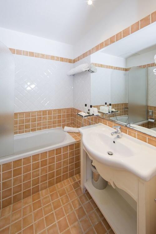 Foto del baño de Colonna Grand Hotel Capo Testa