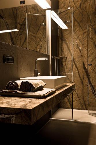 Foto del baño de Alexander Charme Hotel