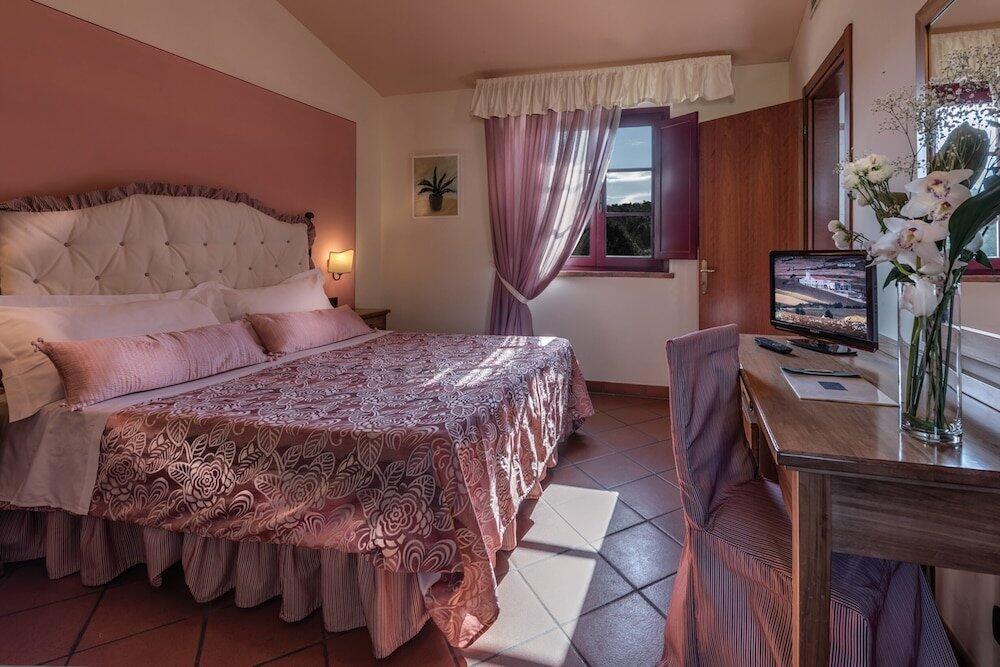 Foto de una habitación de Hotel &amp;amp; Restaurant Casolare Le Terre Rosse