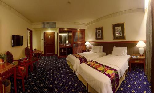 Foto de una habitación de The Jesselton Hotel