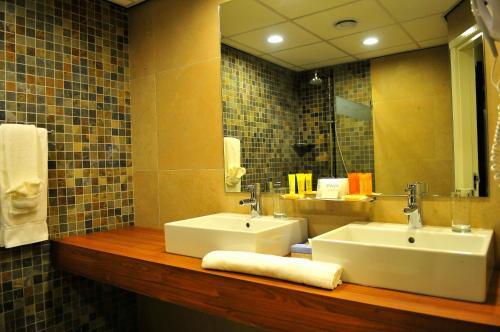 Foto del baño de Holland House Beach Hotel