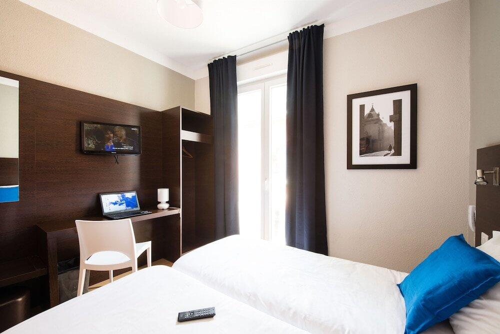 Foto de una habitación de Hôtel Atrium Mondial