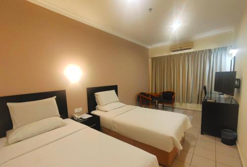 Foto de una habitación de Megah D&amp;#039;aru Hotel