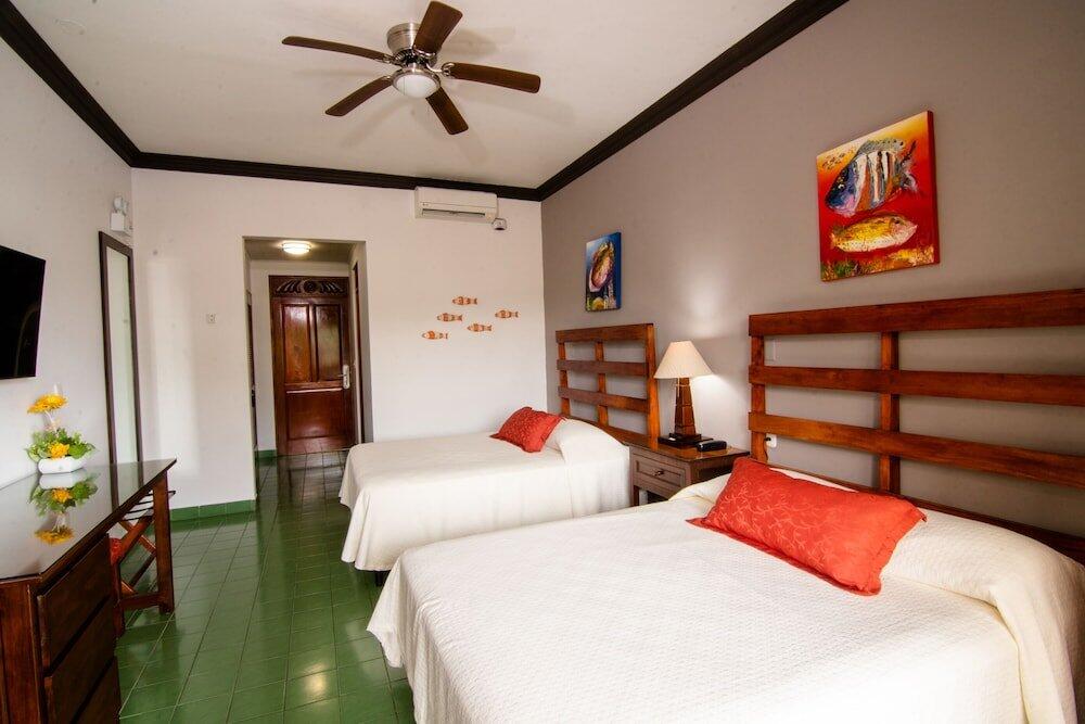 Foto de una habitación de Hotel Club Del Mar