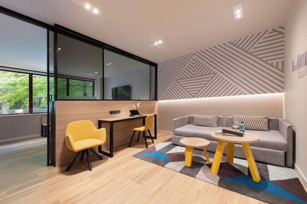 Foto de una habitación de Suites Plaza Hotel &amp;amp; Wellness