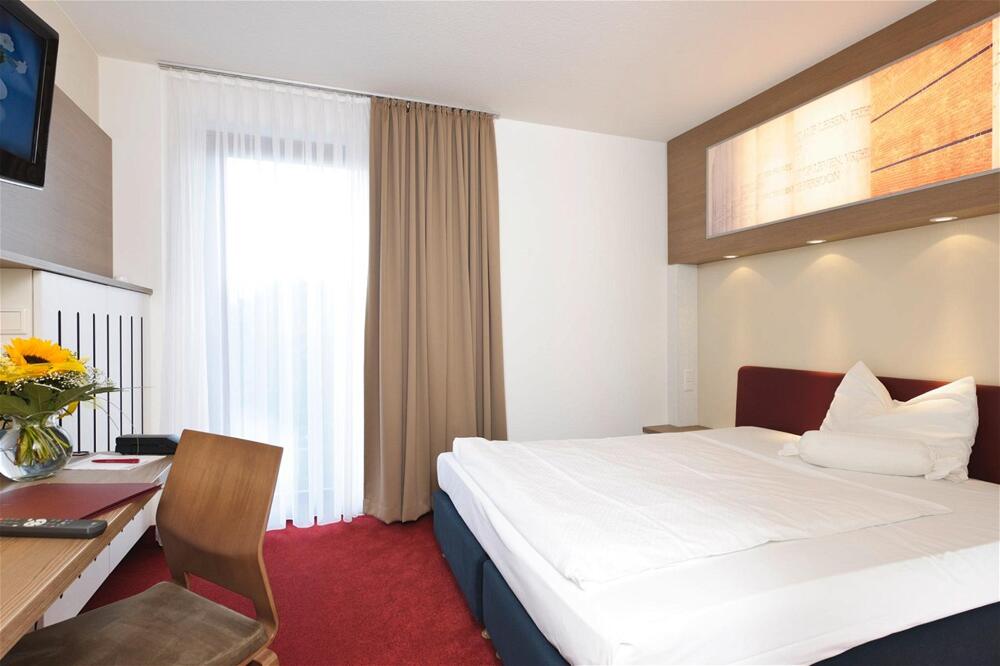 Foto de una habitación de Arvena Park Hotel