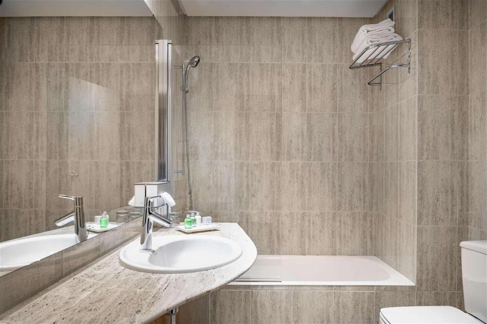 Foto del baño de Hotel NH Ciudad de Cuenca