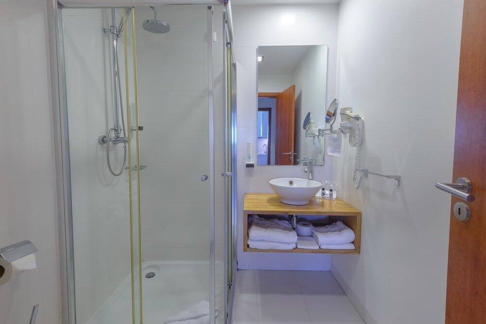 Foto del baño de Amazonia Estoril Hotel
