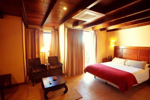 Foto de una habitación de Hotel Alcadima