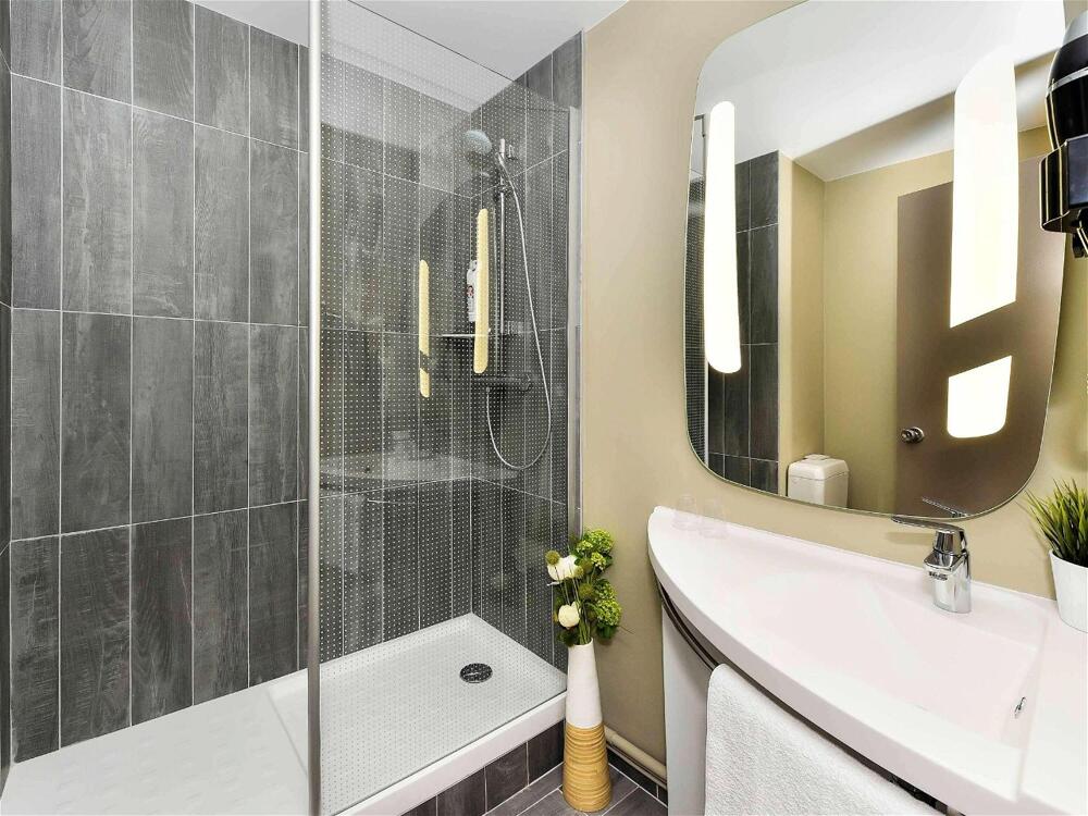 Foto del baño de Hotel ibis Beaune La Ferme Aux Vins